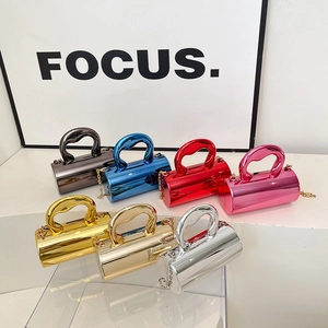 Elegant mini cylinder handbags with metallic mirror finish and stylish chain straps
