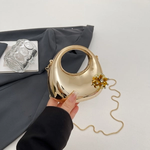 Elegant gold metal half-moon evening clutch bag with crystal flower decoration and chain