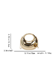 Detailed view of golden crescent clutch with dimensions and floral acrylic decoration