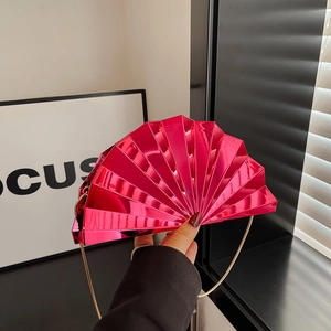 Metallic rose pink fan-shaped hard clutch evening bag with a gold chain strap