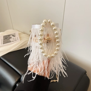 Luxurious white ostrich feather evening bag with large pearl handle and gold chain strap