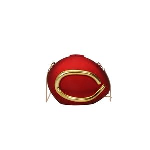Oval red matte evening clutch with curved gold metal trim and fine chain strap