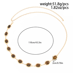 Detail of gold chain belt with cat eye stones and 110cm length measurement annotations