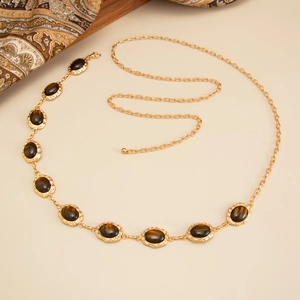 Vintage gold waist chain featuring brown resin cat-eye stones and tassel metal links