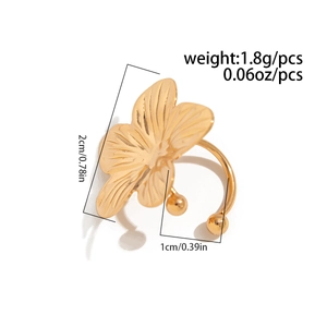 Macro detail of gold flower petal ear cuff featuring a polished alloy finish and texture