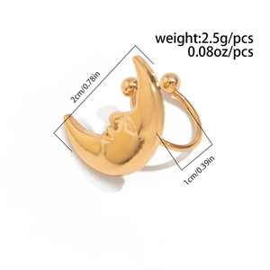 Detailed view of golden crescent moon face ear cuff showing size and metal texture