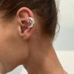 Artistic silver face moon ear cuff for women with a minimalist metallic finish