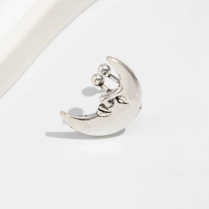 Macro detail of vintage silver moon stud earring with smiley face and screw ball back