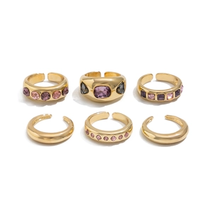 Set of 6 gold adjustable rings featuring purple and grey crystal inlay with a polished finish