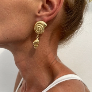 Golden conch shell earrings with pearl detail and textured maritime design for women