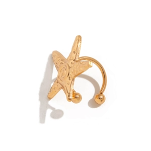 Golden starfish non-pierced ear cuff with vintage textured finish on white background