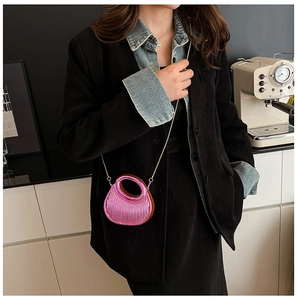 Metallic pink acrylic mini bag with pleated texture and golden chain strap detail