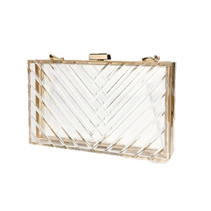 Elegant transparent acrylic evening clutch bag with golden metal trim and chain strap