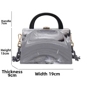 Detail view of marble pattern acrylic bag with dimensions 19x13x9cm and chain strap