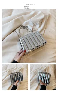 Detailed view of silver acrylic box bag with pleated texture and metal top handle