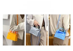 Chic marbled acrylic crossbody bag with resin chain in orange, grey, and blue colors