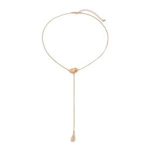 Elegant gold Y-shaped fringe necklace with heart detail and teardrop pendant on white