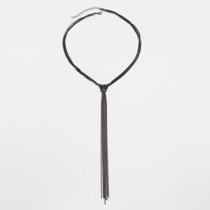 Detail of gunmetal multi-strand Y-necklace with knotted centerpiece and long chain tassels