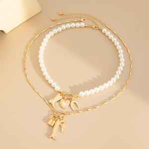Baroque pearl layered necklace set with heart fish charms and good luck horseshoe pendant