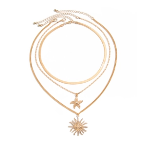Three-layer gold necklace set featuring starfish and sun face pendants on a snake chain