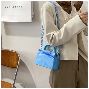 Blue marble acrylic box bag with matching chunky plastic chain strap shown on model