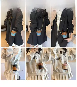 Detailed views of mini bucket crossbody bags with chain straps in multiple colorways