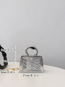 Detailed view of silver V-quilted handbag with chain strap and dimension markings