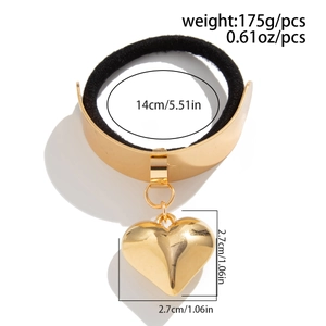 Detail view showing a gold heart pendant hair tie with dimensions 14cm and 2.7cm pendant