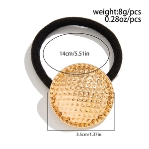 Detail showing dimensions of gold textured metal hair tie with black elastic band