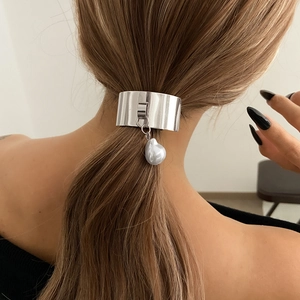 Silver metallic hair cuff with baroque pearl charm styled on a brunette ponytail