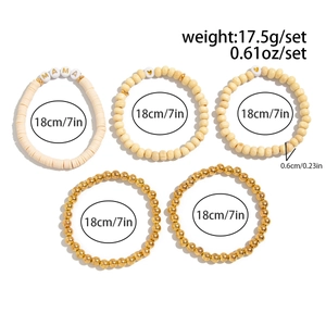 Detailed view of bohemian beaded bracelet set with MAMA letter beads and gold accents