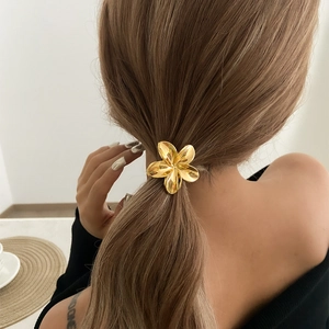 Elegant gold metal flower hair clip for ponytails with a polished mirror finish for women
