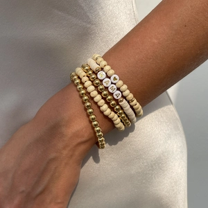 Bohemian 5pcs set of gold and beige beaded bracelets featuring MAMA letter charms