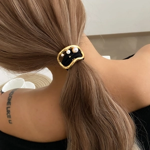 Irregular gold alloy hair tie with white pearls on thick black elastic ponytail holder