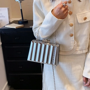 Elegant silver metallic wave textured evening bag with a delicate chain strap