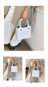 Detail der weißen EVA-Tasche mit Rautenmuster-Textur und perforiertem Design