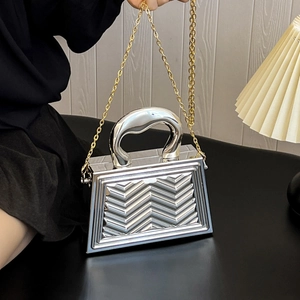 Silver metallic small square handbag with V-shaped chevron texture and gold chain strap