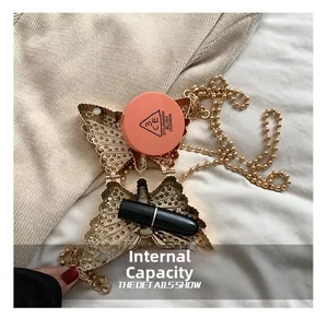 Mini sac papillon en métal avec chaîne vue intérieure pour rouge à lèvres et fond de teint