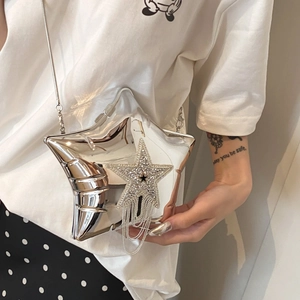 Silver star-shaped crossbody bag with rhinestone tassel and metallic chain strap