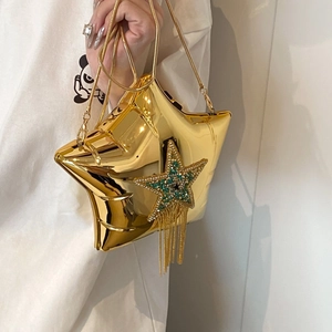 Chic gold star-shaped crossbody bag with sparkling tassel fringe and chain strap