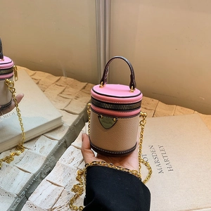 Mini color-block cylinder bucket bag with pink lid and gold chain strap for women