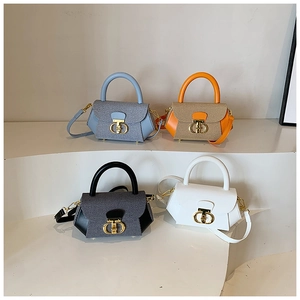 Detailed view of four colorful mini trapezoid handbags with golden double D-ring metal buckles