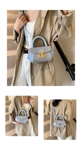 Detail view of mini blue striped crossbody bag with elegant gold CD metal buckle