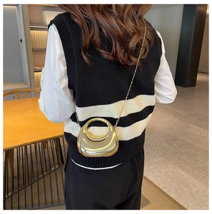 Fashionable half-moon acrylic box bag with a round gold handle and slim chain strap