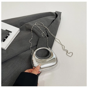 Silver mirror finish acrylic clutch with unique crescent moon handle and bead chain strap
