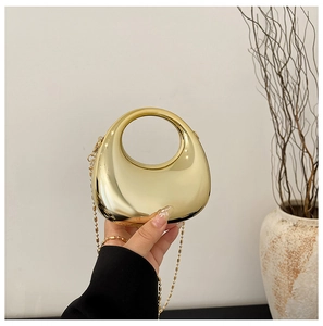 Mirror gold half-moon evening bag with integrated round handle and metal chain strap