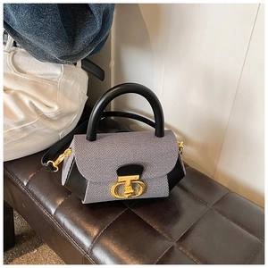 Detail view of the vintage crossbody bag showing its leather stitching and golden CD buckle