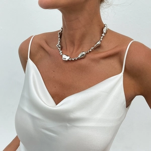 Chic silver irregular CCB pearl necklace with liquid metal texture on female model