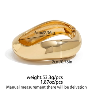 Detailed view of wide gold resin bangle with 2cm width and 6cm inner diameter measurements