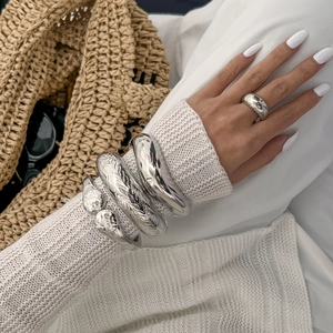 Minimalist silver irregular metal bracelet set with polished bangle and thick ring on model